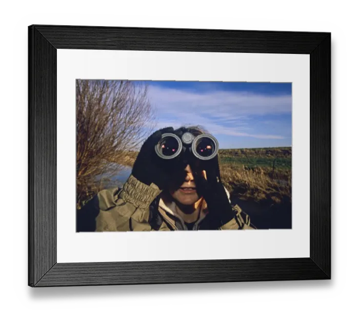 Framed Print : female birdwatching in Norfolk in winter Framed Print : female birdwatching in Norfolk in winter