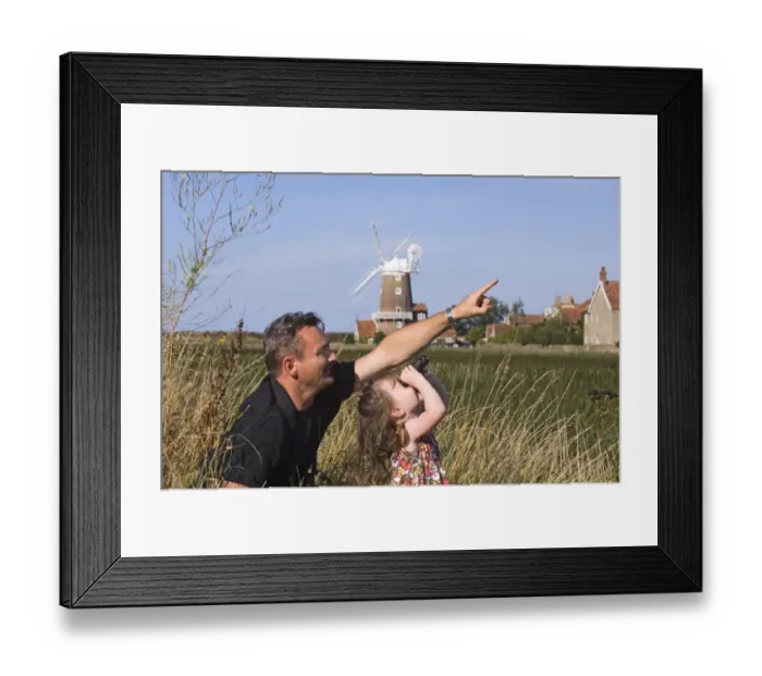 Framed Print : Father and daughter birdwatching at Cley North Norfolk August Framed Print : Father and daughter birdwatching at Cley North Norfolk August