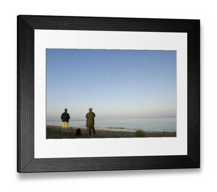 Framed Print : Bird watchers watching Knot and other waders stream off The Wash ats the tide rises Framed Print : Bird watchers watching Knot and other waders stream off The Wash ats the tide rises