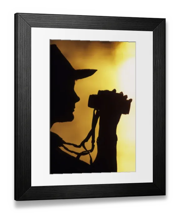 Framed Print : 01928dt. Female birder silhouetted