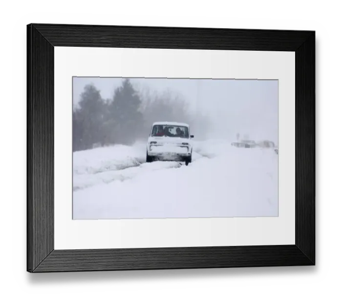 Framed Print : Car travelling along snow covered road during blizzard on route to Kazbegi Great Framed Print : Car travelling along snow covered road during blizzard on route to Kazbegi Great