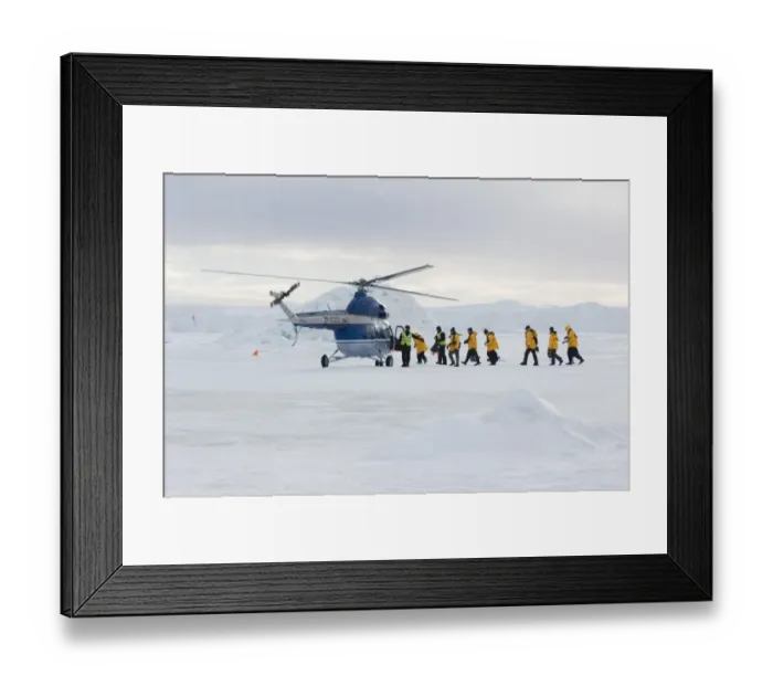 Framed Print : 02603dt. Eco-tourists boarding helicopter to be taken back to Kapitan Klebnikov Icebreaker