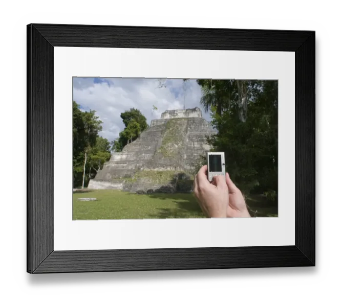 Framed Print : Tourist using a digital camera to photograph a Mayan temple at Yaxha nr Tikal Guatemala Framed Print : Tourist using a digital camera to photograph a Mayan temple at Yaxha nr Tikal Guatemala