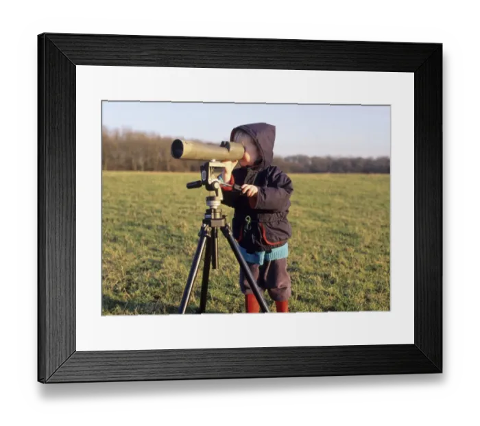 Framed Print : Fledgling birder looking through scope Kent winter Framed Print : Fledgling birder looking through scope Kent winter