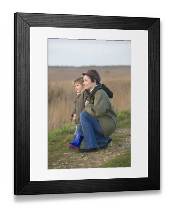 Framed Print : mother and son on bird reserve at Cley Norfolk winter Framed Print : mother and son on bird reserve at Cley Norfolk winter