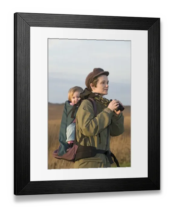 Framed Print : mother carrying toddler in backpack while bird watching along coastal path North Framed Print : mother carrying toddler in backpack while bird watching along coastal path North