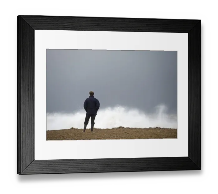 Framed Print : Man looking out across a rough North Sea off Cley Norfolk November Framed Print : Man looking out across a rough North Sea off Cley Norfolk November