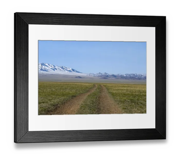 Framed Print : Road across the Gobi Desert below Altai Mountains within Gobi National Park Mongolia Framed Print : Road across the Gobi Desert below Altai Mountains within Gobi National Park Mongolia
