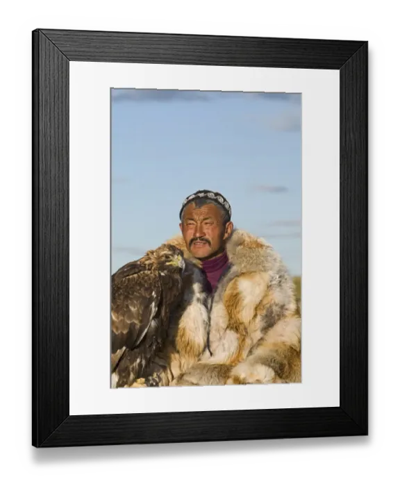 Framed Print : Dalai Han an Kazakh eagle hunter with his Golden Eagle Bayan-Ulgii in Altai Mountains