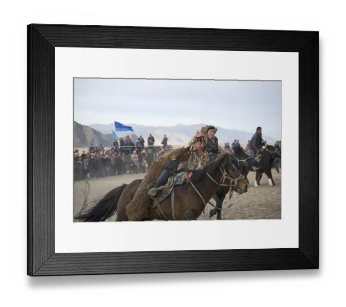Framed Print : The victor from a game of Kurbar (tug of war on horseback) gallops around arena Framed Print : The victor from a game of Kurbar (tug of war on horseback) gallops around arena