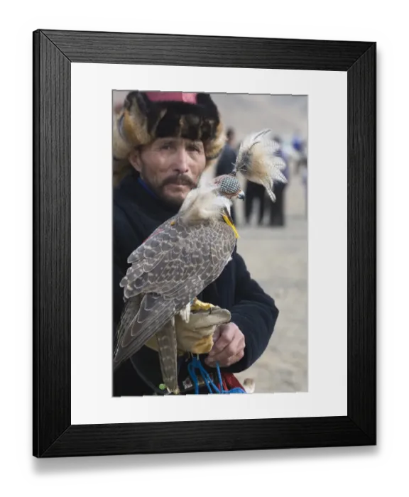 Framed Print : Kazakh hunter with Saker Falcon at Eagle hunters festival near Ulgii in western Mongolia