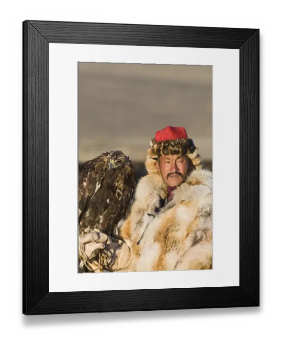 Framed Print : Dalai Han an Kazakh eagle hunter with his Golden Eagle Bayan-Ulgii in Altai Mountains