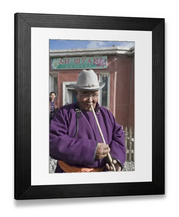 Framed Print : Market trader in Bayan-Ulgii playing a flute western Mongolia Framed Print : Market trader in Bayan-Ulgii playing a flute western Mongolia