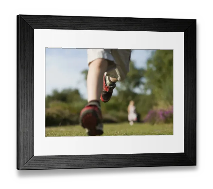 Framed Print : Young boy running on heath exploring nature Norfolk summer Framed Print : Young boy running on heath exploring nature Norfolk summer