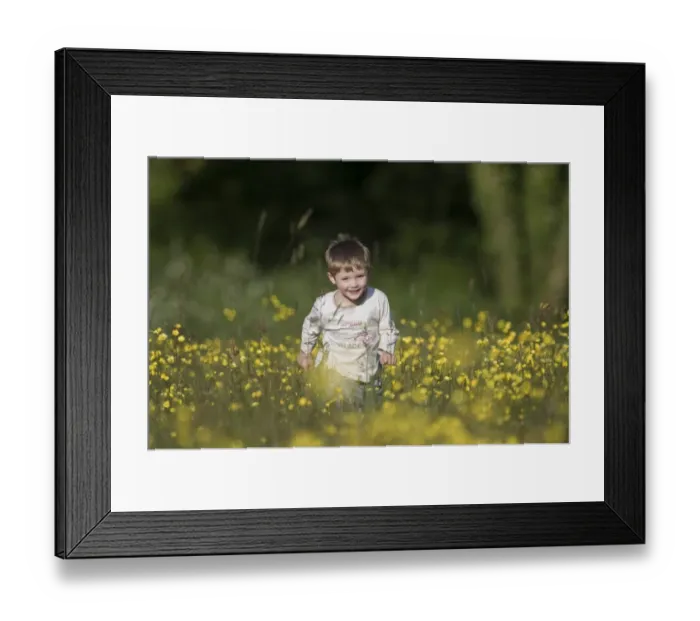 Framed Print : Young boy running through field of buttercups Norfolk May Framed Print : Young boy running through field of buttercups Norfolk May