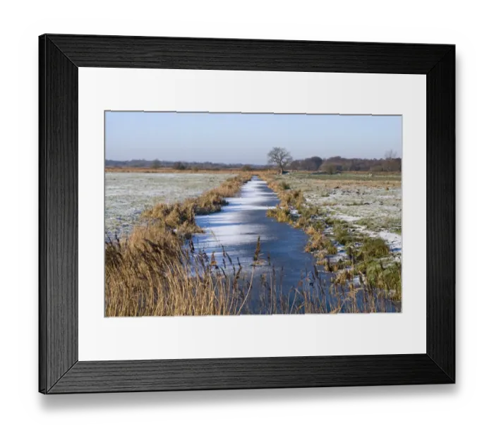 Framed Print : Frozen dyke on Buckenham Marshes RSPB Reserve in Yare Valley Norfolk winter Framed Print : Frozen dyke on Buckenham Marshes RSPB Reserve in Yare Valley Norfolk winter