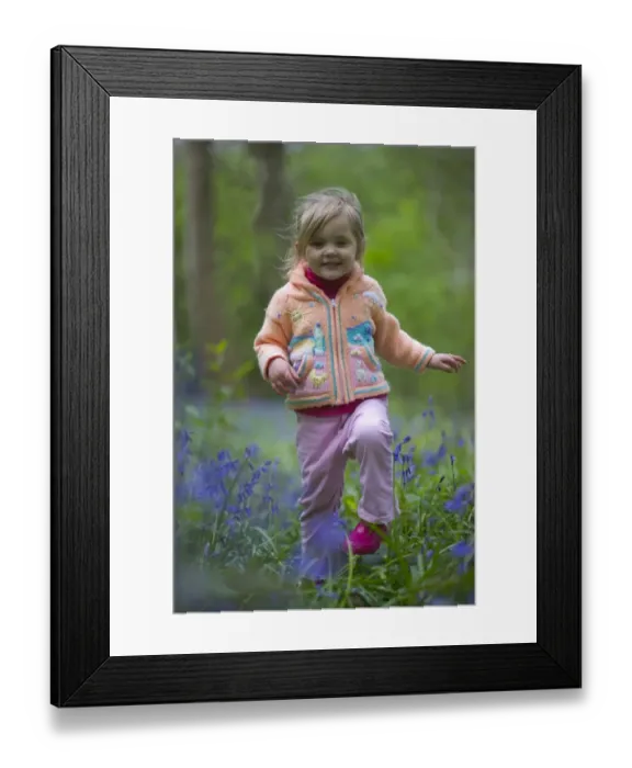 Framed Print : Young girl in Bluebell Wood North Norfolk May UK Framed Print : Young girl in Bluebell Wood North Norfolk May UK