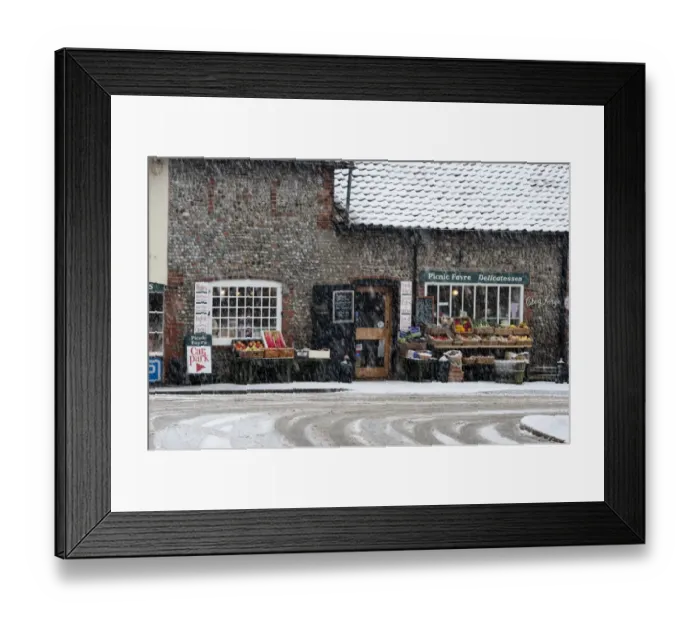 Framed Print : Picnic Fayre shop in falling snow Cley Norfolk in winter Framed Print : Picnic Fayre shop in falling snow Cley Norfolk in winter
