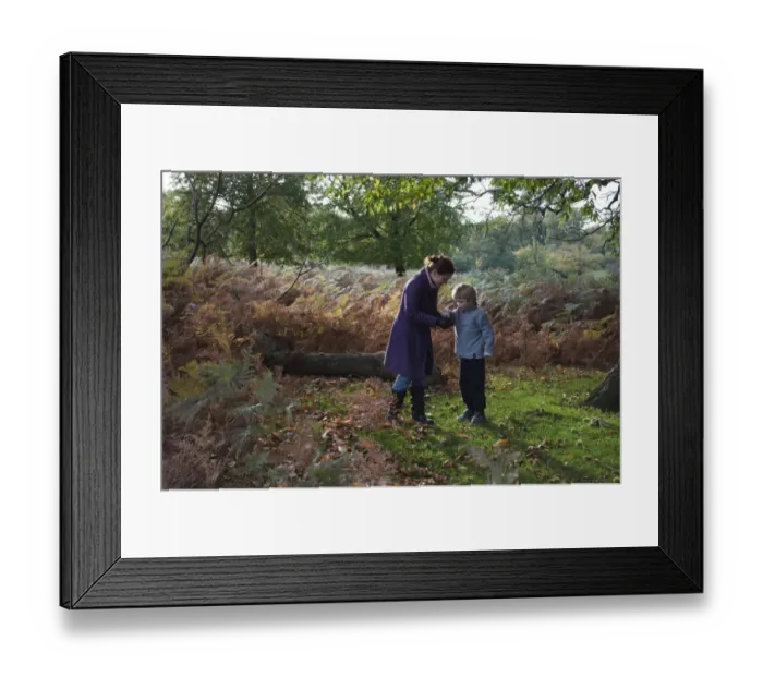 Framed Print : Mother and son in woodland in autumn Kent UK Framed Print : Mother and son in woodland in autumn Kent UK