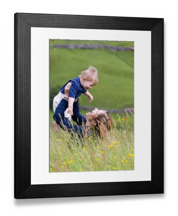 Framed Print : Mother and ten month old boy in field in summer UK Framed Print : Mother and ten month old boy in field in summer UK