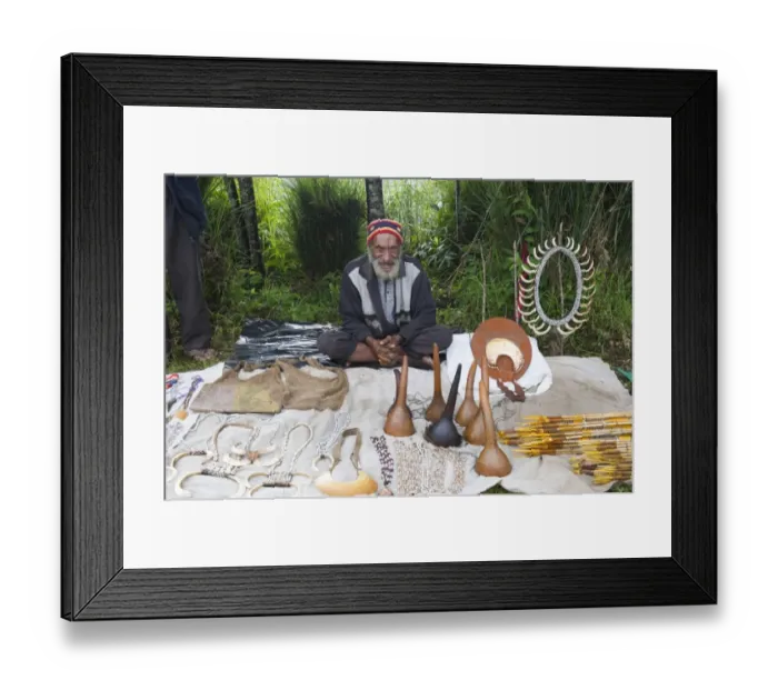 Framed Print : Man selling Penis gourds, pig tusks and various other items at Paiya Show Western Framed Print : Man selling Penis gourds, pig tusks and various other items at Paiya Show Western