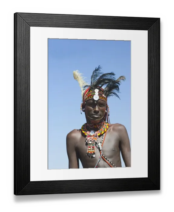 Framed Print : Young Masai man wearing Ostrich feathers signifying recent circumsision Samburu Kenya Framed Print : Young Masai man wearing Ostrich feathers signifying recent circumsision Samburu Kenya