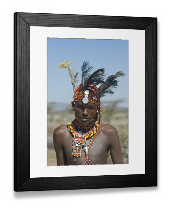 Framed Print : Young Masai man wearing Ostrich feathers signifying recent circumsision Samburu Kenya Framed Print : Young Masai man wearing Ostrich feathers signifying recent circumsision Samburu Kenya