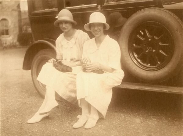 Two 1920s ladies and large car