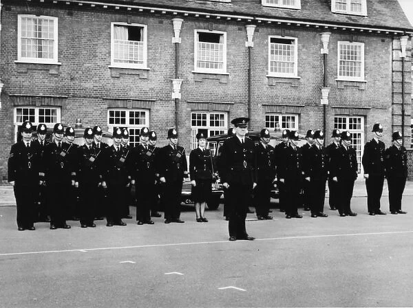 Male and female police officers at an inspection parade