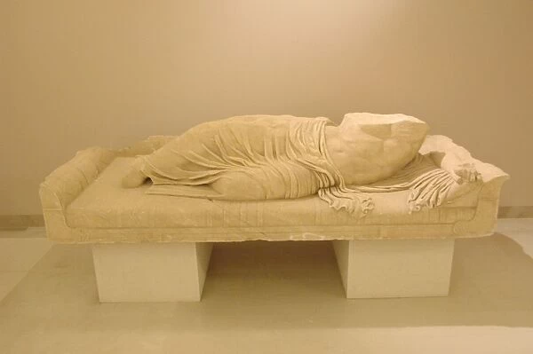 Statue of a reclining man. Greece