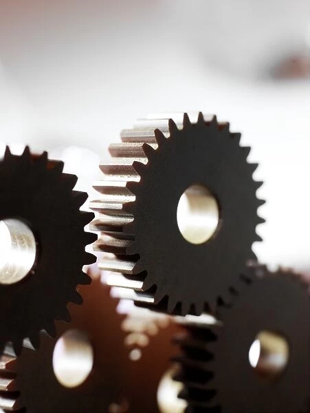 Cogs. Cogs are used in machines to change the direction and speed of rotational motion
