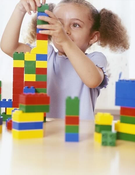 Girl playing with lego