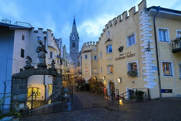 The Goldener Adler Hotel and the bell tower of Cathedral of Brixen (Bressanone)