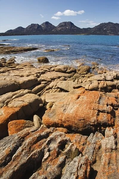Lichen covered red granite rocks at the Hazards Mountain Range, Coles Bay