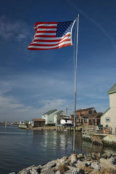 USA, New York, Queens, Jamaica Bay, house and flag near Rockaway Beach