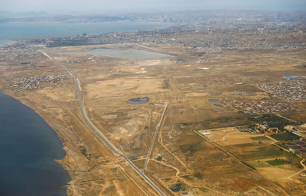 An aerial view of Baku city is pictured through the window of Turkish Airlines airplane
