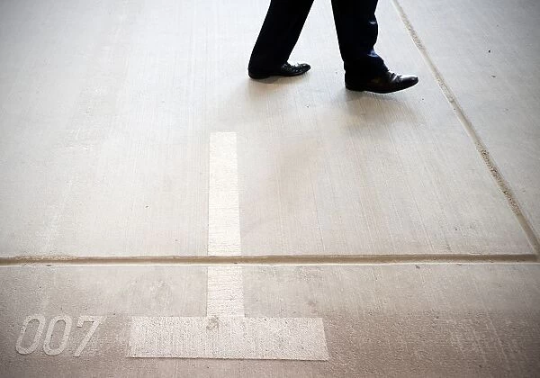 Visitor walks on the car park place numbered 007 at German Federal Intelligence Agency