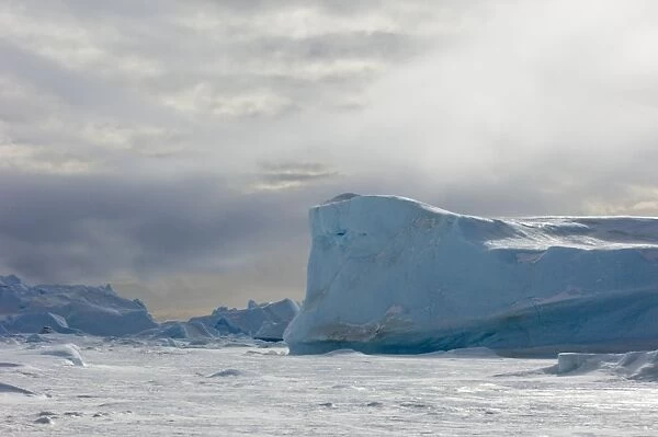 02601dt. Blue Iceberg stuck in the sea ice of the Weddell Sea Antarctica November