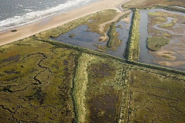 Aerial view of saltmarsh and lagoons at Titchwell RSPB Reserve North Norfolk autumn