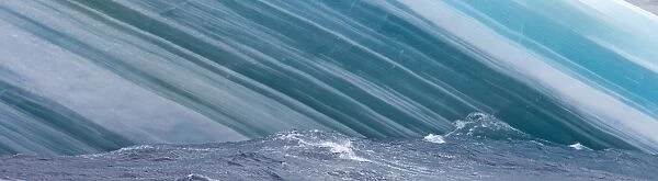 Close up of side of iceberg showing layers of compacted blue ice Southern Ocean off