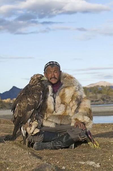 Dalai Han an Kazakh eagle hunter with his Golden Eagle Bayan Ulgii in Altai Mountains