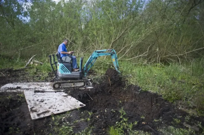 Framed Print : Excavating a wildlife pond in Ferry Wood Norfolk Broads spring Framed Print : Excavating a wildlife pond in Ferry Wood Norfolk Broads spring