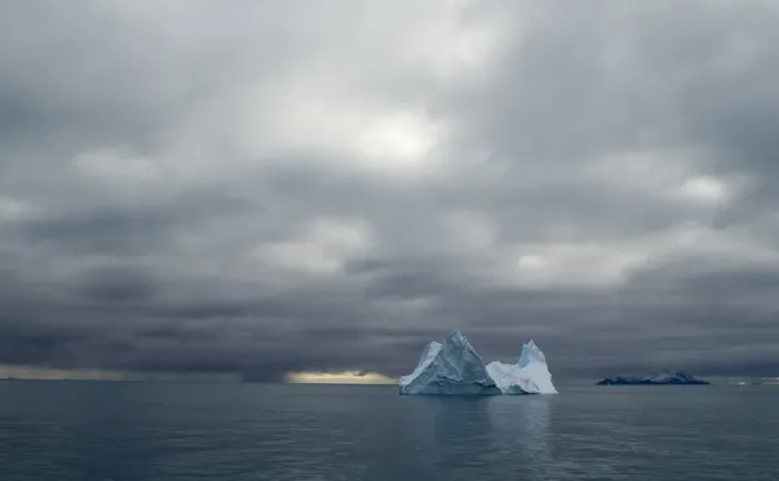 Framed Print : Iceberg and in distance Annekov Island off the rarely visited south west coast of