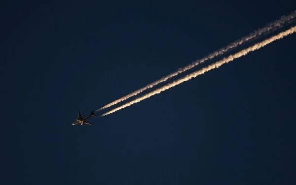 Jet airliner over Norfolk at dusk