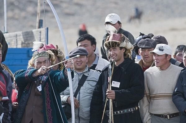Kazakhs enjoying an archery competition at Eagle Hunters Festival Bayan-Ulgii in