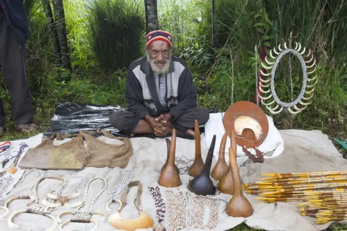 Framed Print : Man selling Penis gourds, pig tusks and various other items at Paiya Show Western Framed Print : Man selling Penis gourds, pig tusks and various other items at Paiya Show Western
