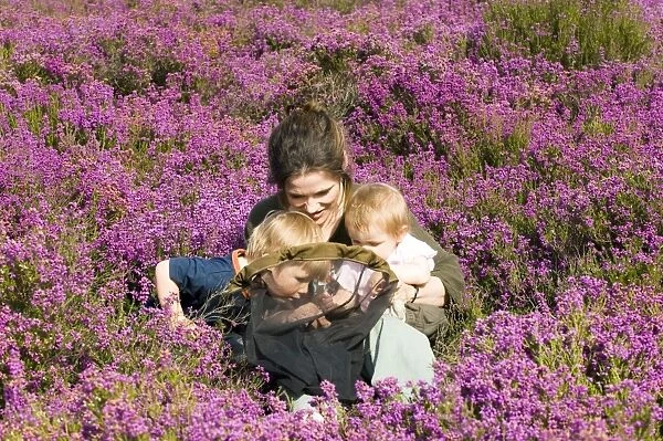 Mother and kids on heath in summer Norfolk UK