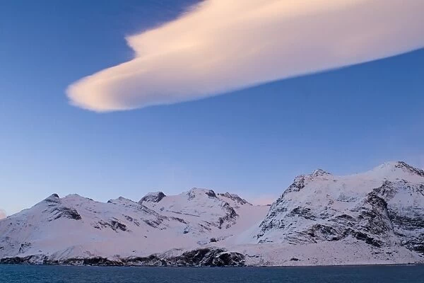 Mountains bordering Gold Harbour and Lenticular cloud South Georgia November
