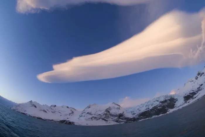Framed Print : Mountains bordering Gold Harbour and Lenticular cloud South Georgia November