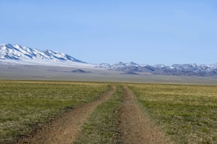 Framed Print : Road across the Gobi Desert below Altai Mountains within Gobi National Park Mongolia Framed Print : Road across the Gobi Desert below Altai Mountains within Gobi National Park Mongolia